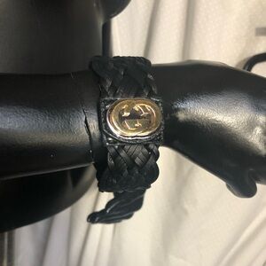 Gucci ZUMI Black Braided Leather Bracelet with Gold tone logo.